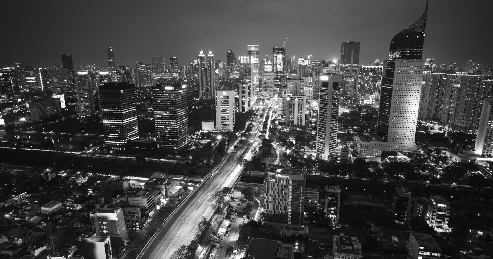 Central Jakarta’s business district at night, October 2015. Photo: Bagus Ghufron via Wikimedia Commons, CC0.