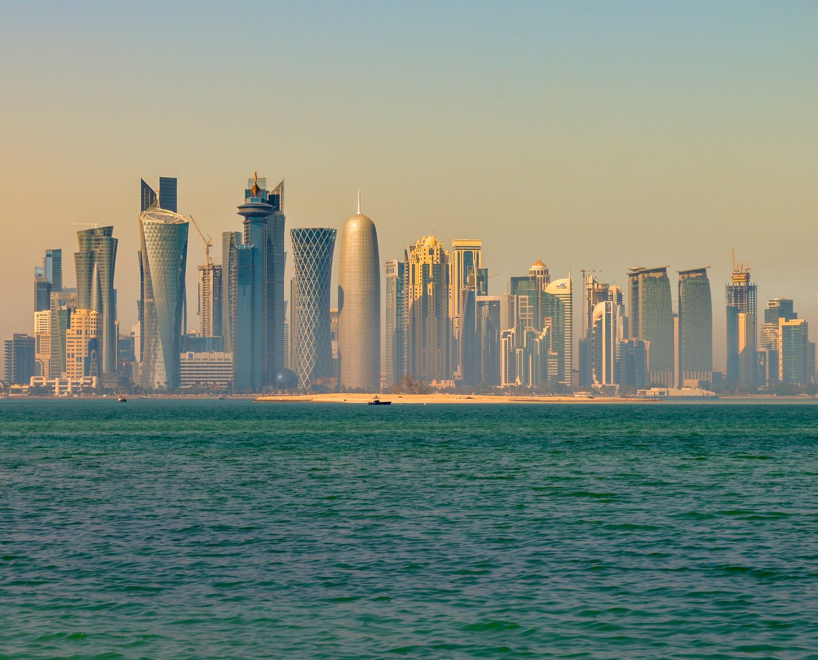 Doha's West Bay skyline across the bay, in a photograph from 2014. Tom Barrack made the remark at the Global Security Forum in Doha on 20 October 2026. Photo: Francisco Anzola / Wikimedia Commons, CC BY 2.0.