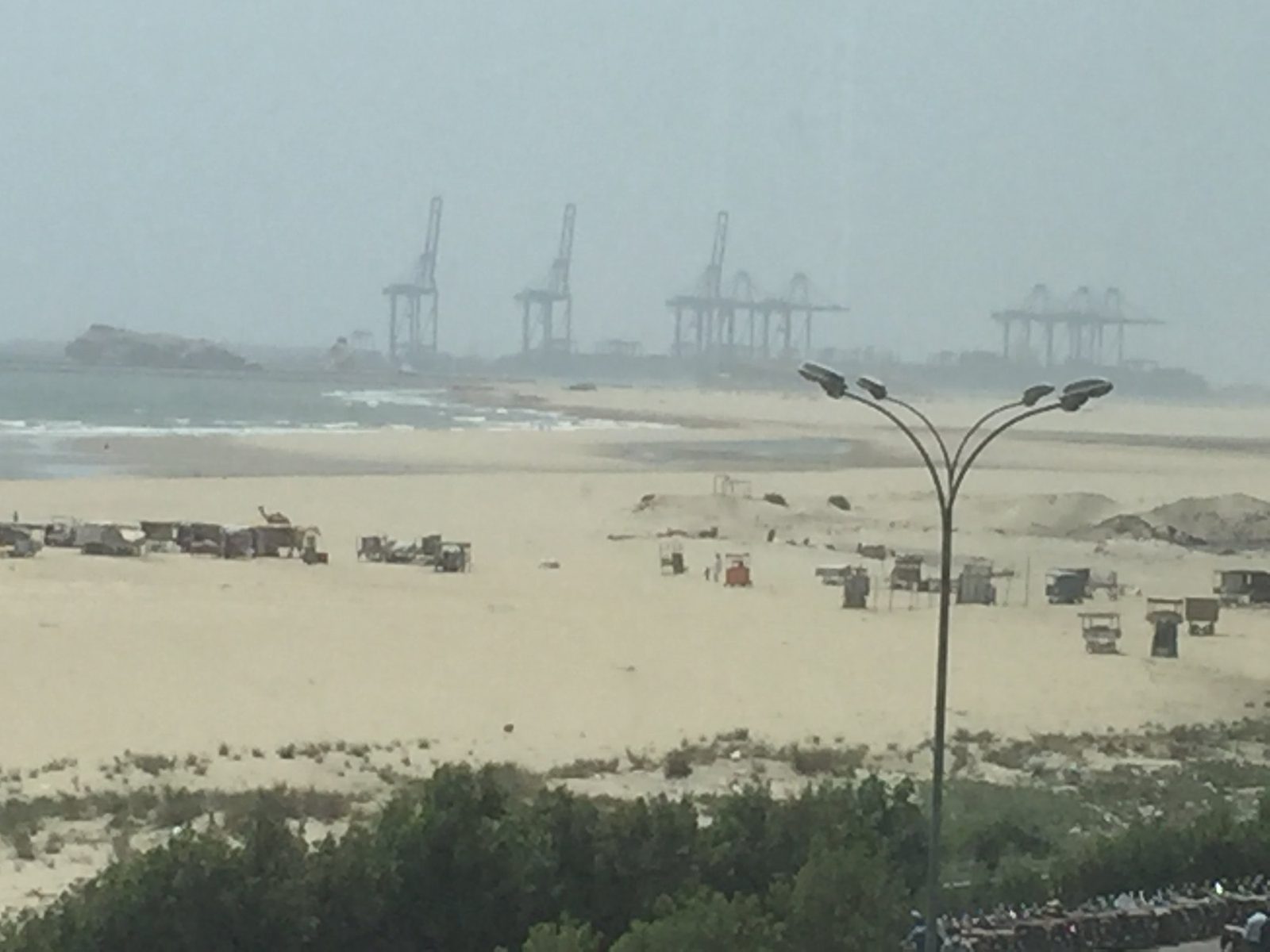 Cranes at Gwadar Port seen from the beach, Balochistan, 2017. Photo: Insia.rakla via Wikimedia Commons, CC BY-SA 4.0.